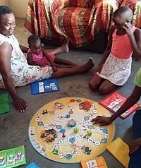 Women and children playing Dipeo in Rakops, Botswana